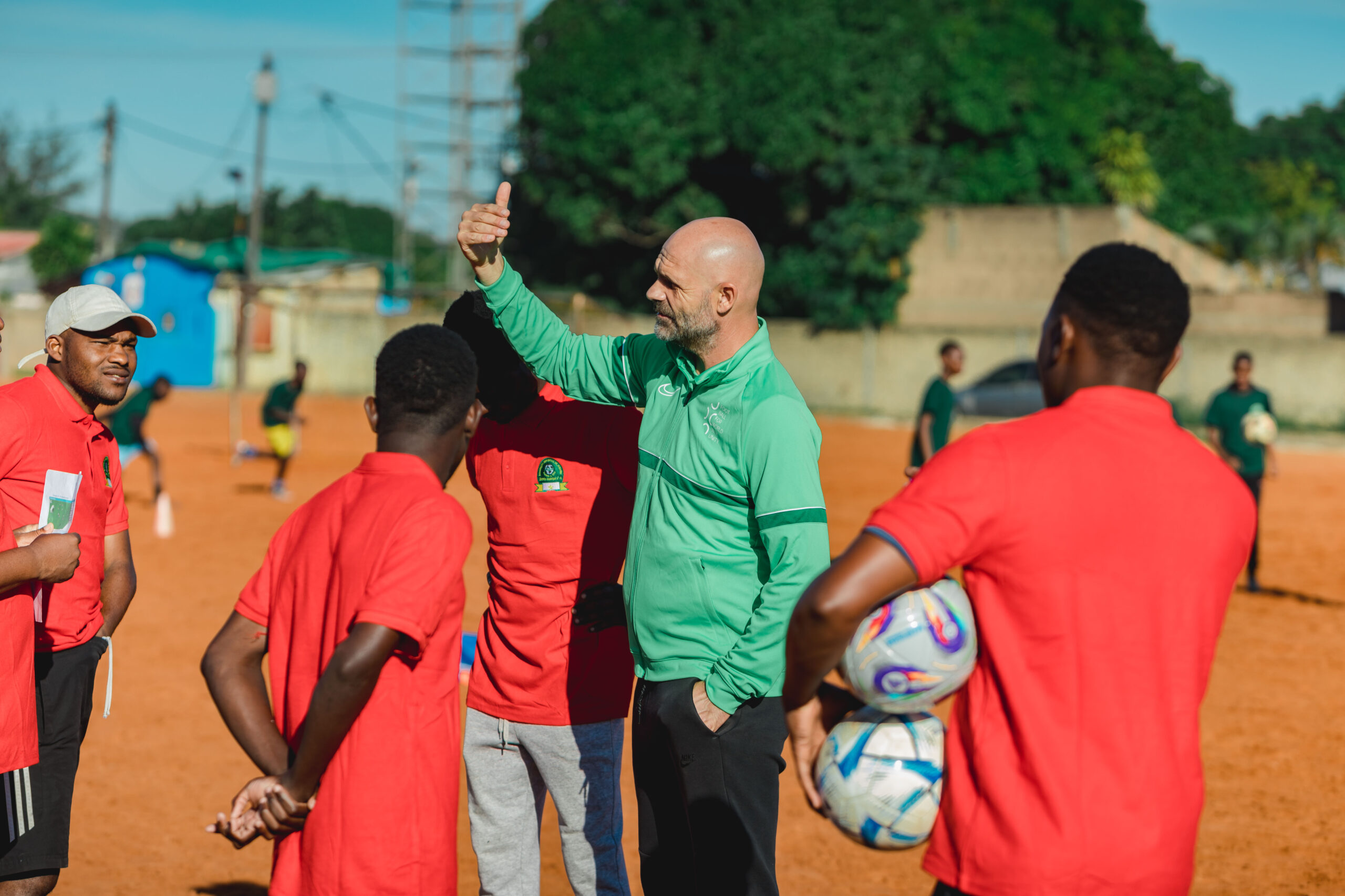 A local coach leading a training session in Albasine