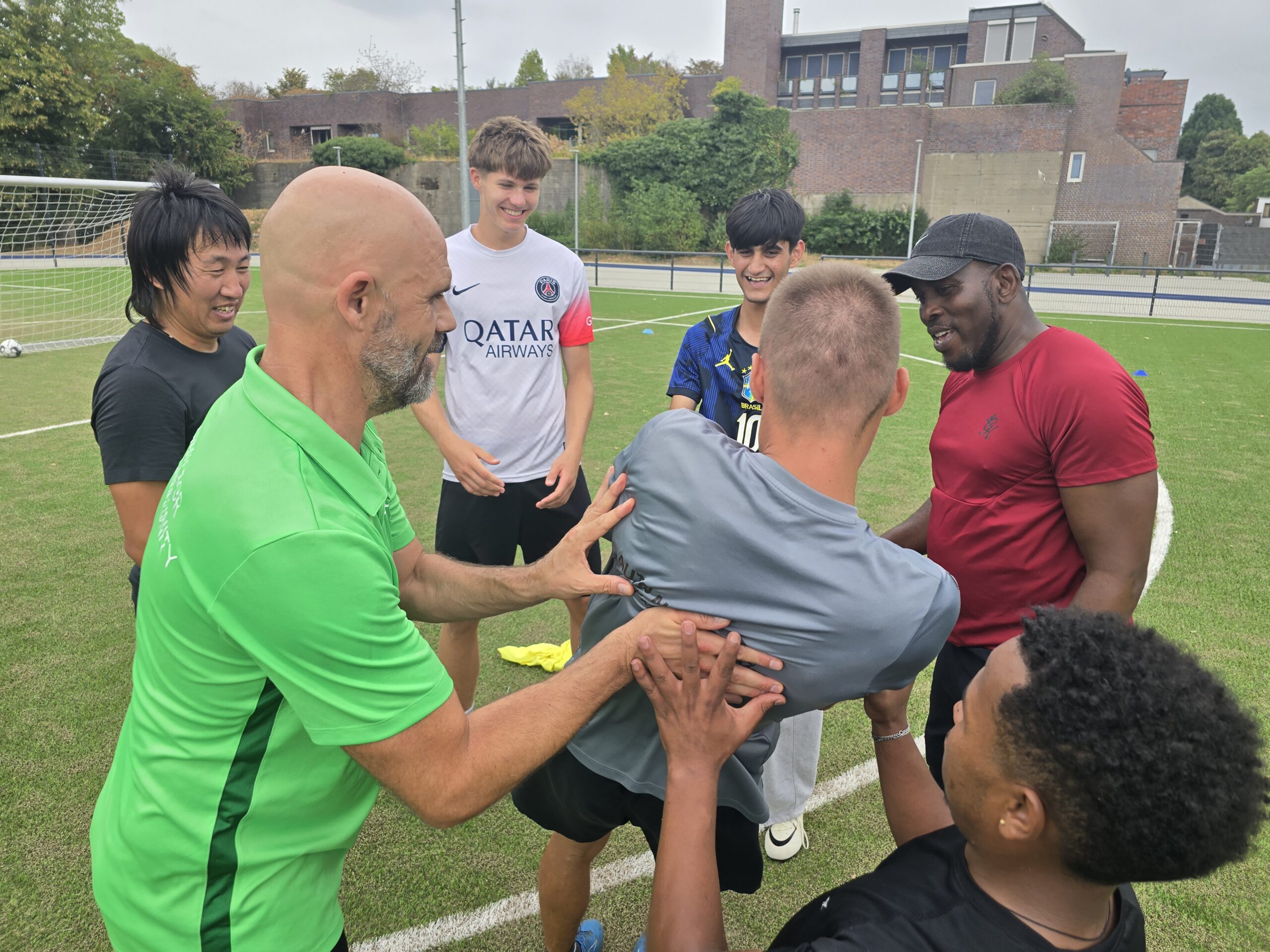 Coach and children at the camp in Mönchengladbach